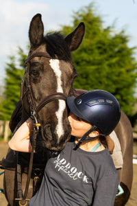 Horse rider kissing bay horse - Paddock Equestrian Apparel